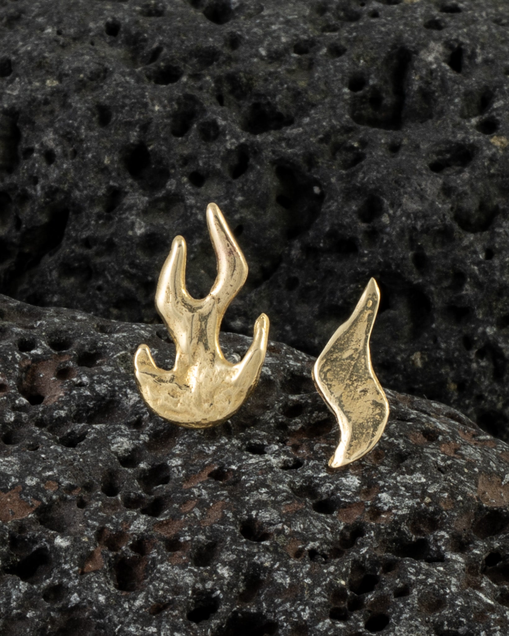 Flame Earrings in bronze on dark volcanic rock, product shot — Zefiro Jewels
